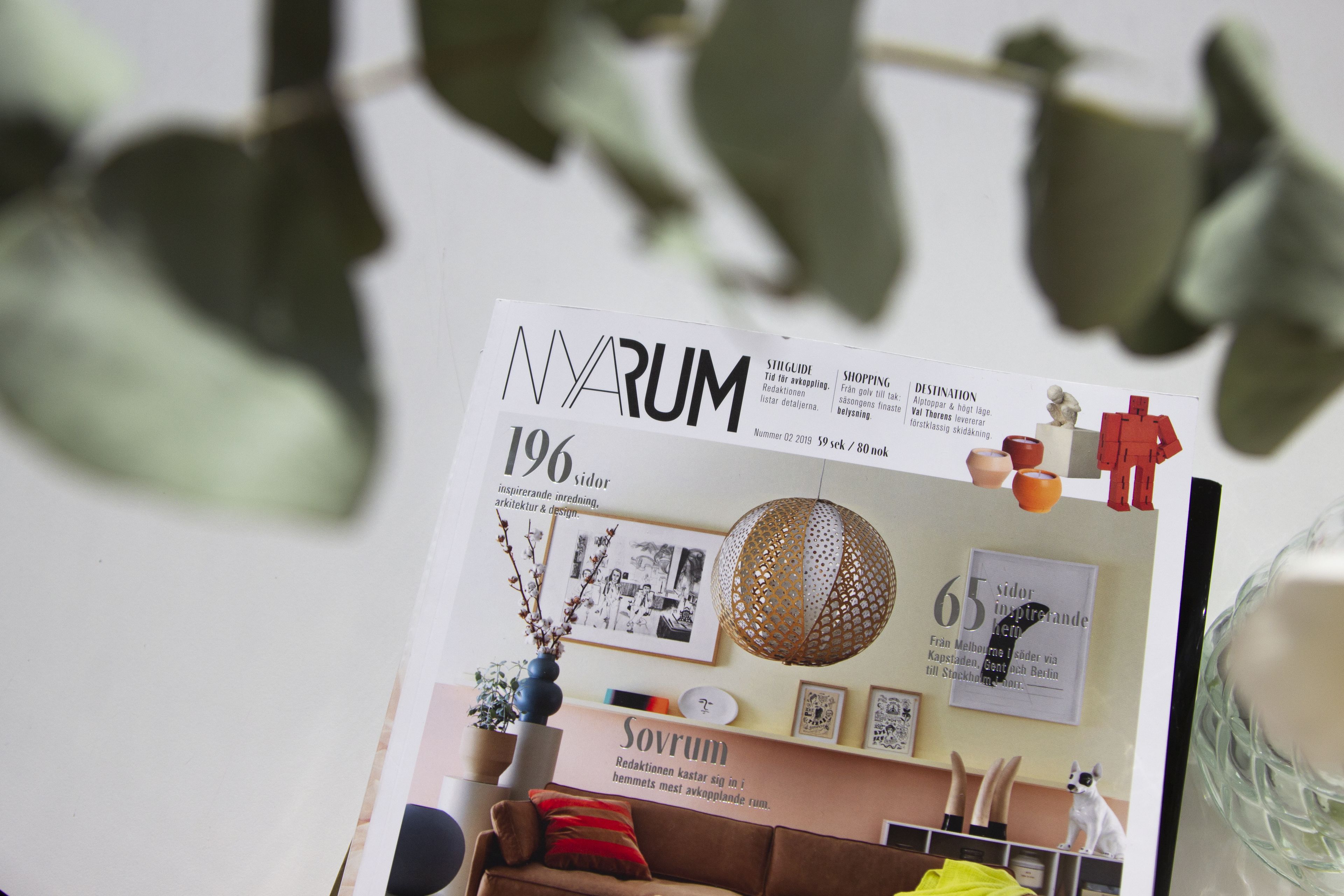 A magazine or brochure with the title 'NARUM' and various sections including 'SHOPPING' and 'DESTINATION'.