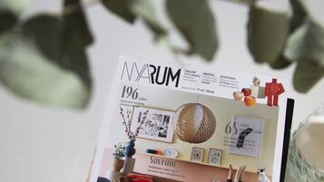 A magazine or brochure with the title 'NARUM' and various sections including 'SHOPPING' and 'DESTINATION'.