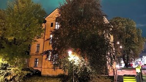 A building with multiple windows and a tree in front. - Livin Station (Örebro)