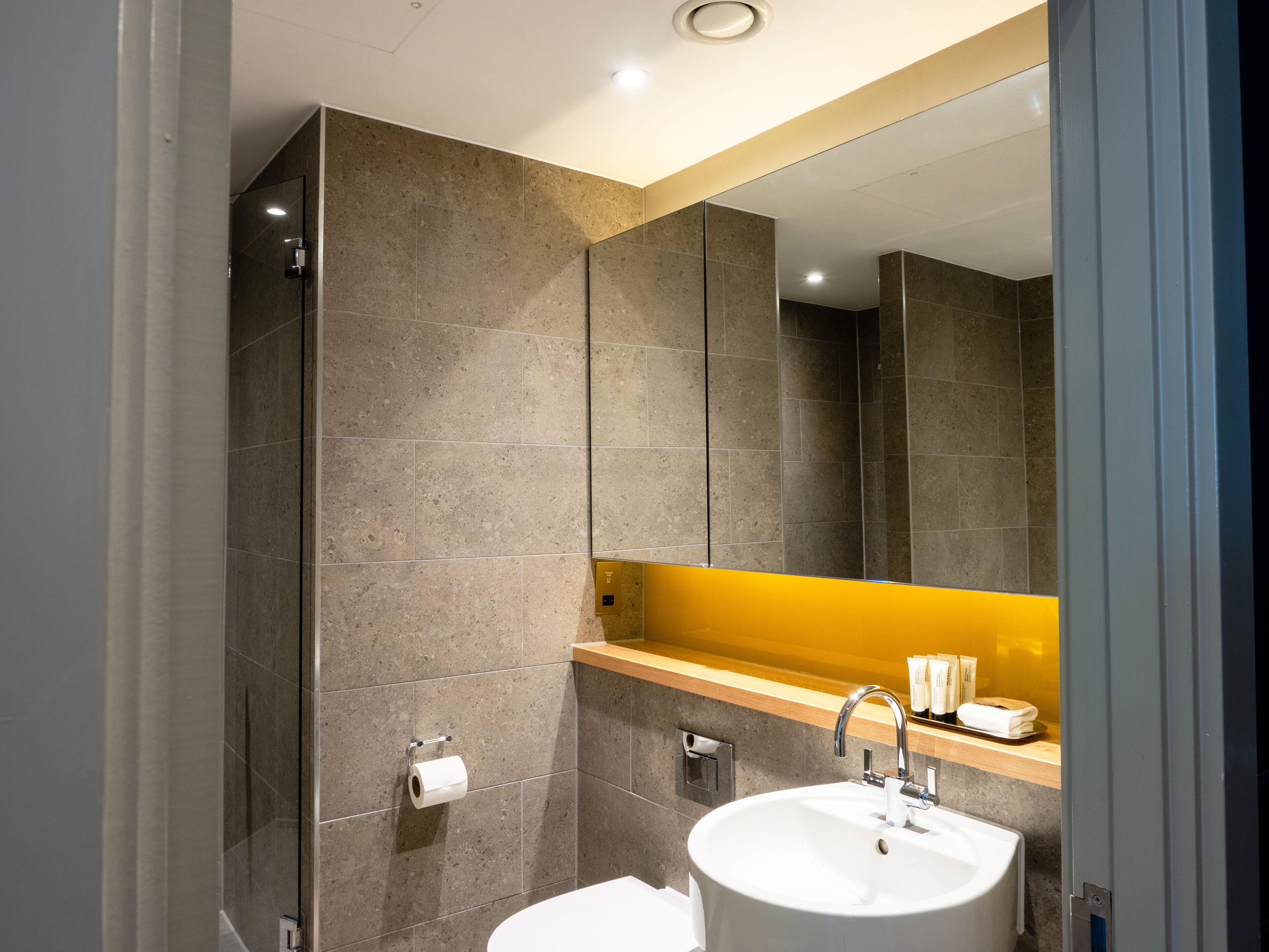 family room | bathroom | designer toiletries, hair dryer, towels