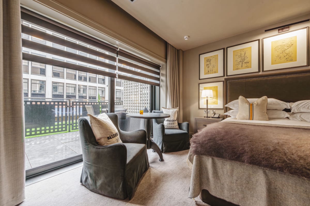 room, 1 king bed, garden area | living area | 49-inch flat-screen tv with satellite channels, tv