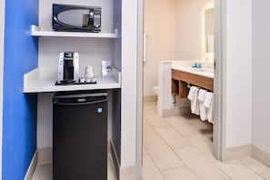 A compact kitchenette with a microwave, coffee maker, and dishwasher. - Holiday Inn Express & Suites Van Horn by IHG (Van Horn)