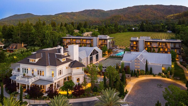 A large resort with multiple buildings, a swimming pool, and a vineyard in the background. - Alila Napa Valley, a Hyatt Luxury Resort (St. Helena)