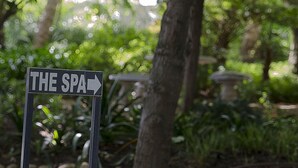 A sign indicating 'THE SPA' with an arrow pointing to the right.
