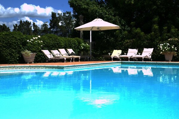 2 outdoor pools, pool umbrellas, pool loungers