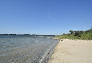 On the beach, sun-loungers