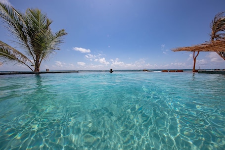 Outdoor pool, open 8:00 AM to 7:00 PM, pool umbrellas, sun loungers