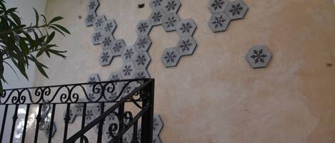A wall with hexagonal tiles arranged in a honeycomb pattern.