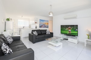 Nuvo - 2 Bedroom with Courtyards | Living room | Flat-screen TV, DVD player