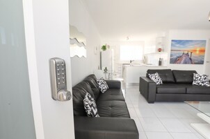 Nuvo - 2 Bedroom with Courtyards | Living room | Flat-screen TV, DVD player