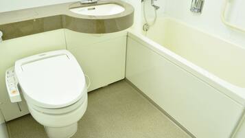 A bathroom with a toilet, sink, and bathtub.