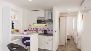Apartment, 1 Bedroom | Private kitchen | Fridge, microwave, stovetop, electric kettle