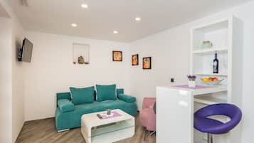 Apartment, 1 Bedroom | Living room | Flat-screen TV