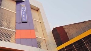 A hotel building with a prominent 'PAN HOTEL' sign on the facade.