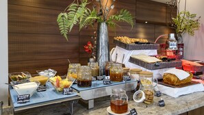 A breakfast buffet with various food items and condiments. - Résidence de Tourisme Ajaccio Amirauté (Ajaccio)