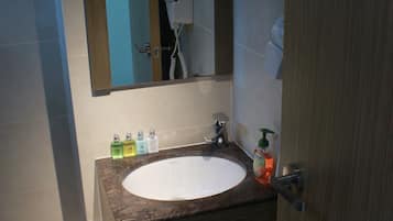 Shower, free toiletries, slippers, towels