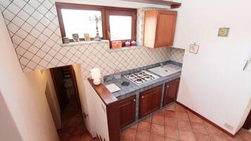 Departamento, 3 habitaciones | Cocineta privada | Refrigerador, parrilla de estufa y tetera eléctrica