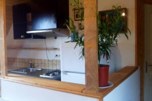 Estudio, vista al jardín (LOFT) | Cocina privada | Periquera