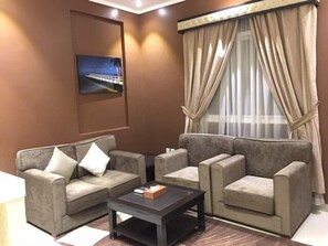 Departamento, 1 habitación | Área de sala de estar | Televisión LCD 