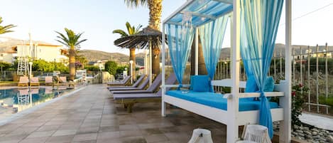 Seasonal outdoor pool, pool umbrellas, pool loungers