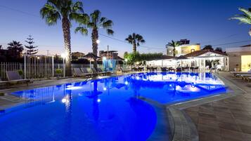 Seasonal outdoor pool, open 9:00 AM to 8:00 PM, pool umbrellas