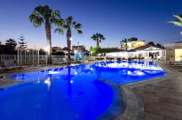 Seasonal outdoor pool, open 9:00 AM to 8:00 PM, pool umbrellas
