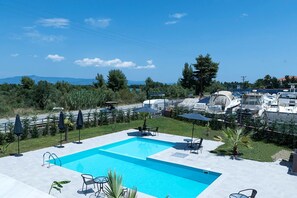 Outdoor pool, pool umbrellas, pool loungers