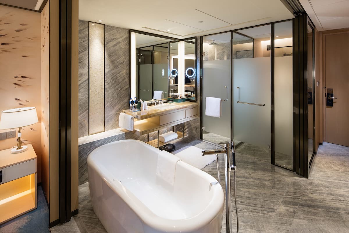 separate bathtub and shower, free toiletries, hair dryer, slippers