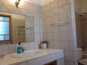 A bathroom with a sink, mirror, and shower. - Historical Charming Vintage Villa with 4 bedrooms & country views 4 Villa by RedAwning (Alcobaça)