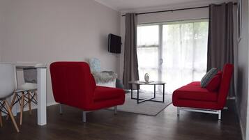 Apartemen Mewah, 1 kamar tidur | Area keluarga | TV layar datar