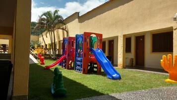 Children can play and climb in this vibrant play area with slides and climbing elements.