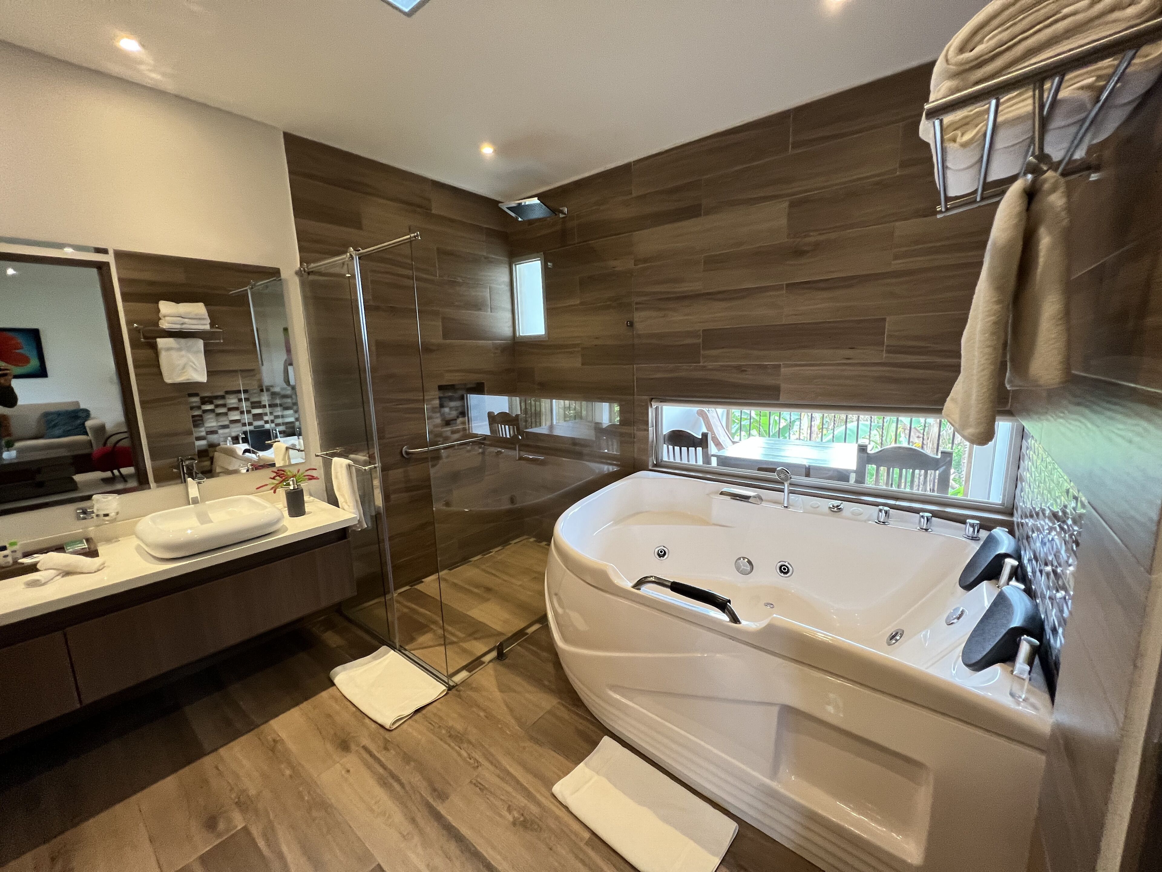 deluxe studio suite, 1 king bed | bathroom | shower, free toiletries, hair dryer, towels
