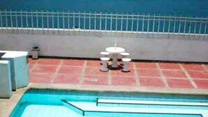 A swimming pool with a view of the ocean. - Apartamento Tropical - Smr245a (Santa Marta)