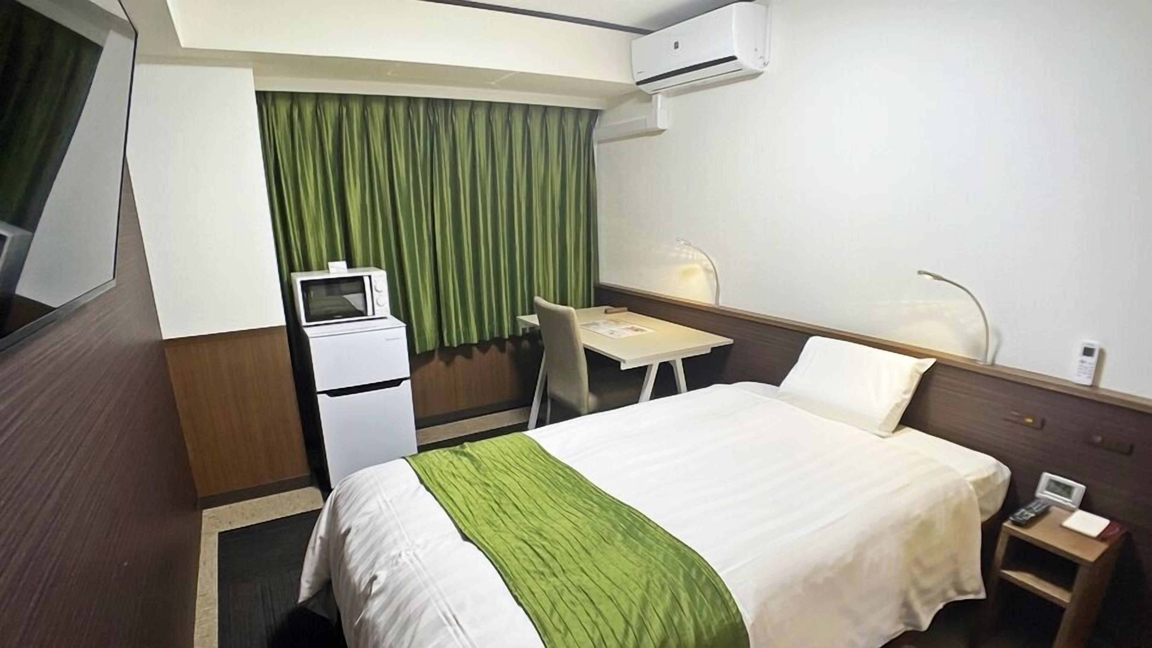 Down duvets, desk, laptop workspace, blackout curtains