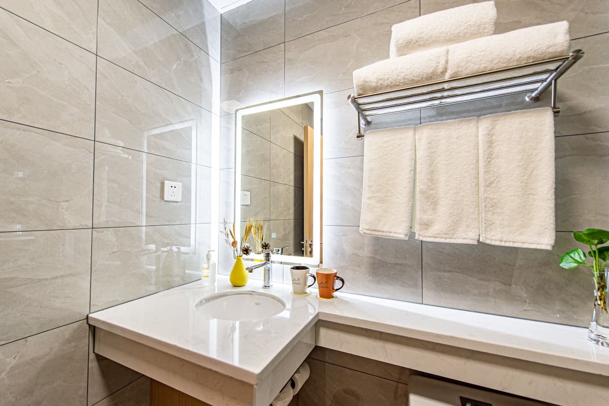 family room | bathroom | shower, free toiletries, hair dryer, slippers