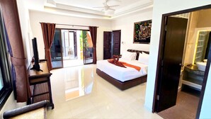 A hotel room with a large bed, a flat-screen TV, a desk, and a sliding glass door to the outside. - HIDELAND Luxury Pool Villa Pattaya Walking Street (Pattaya)