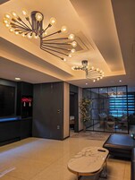 Royal Suite | Living area | Flat-screen TV, heated floors