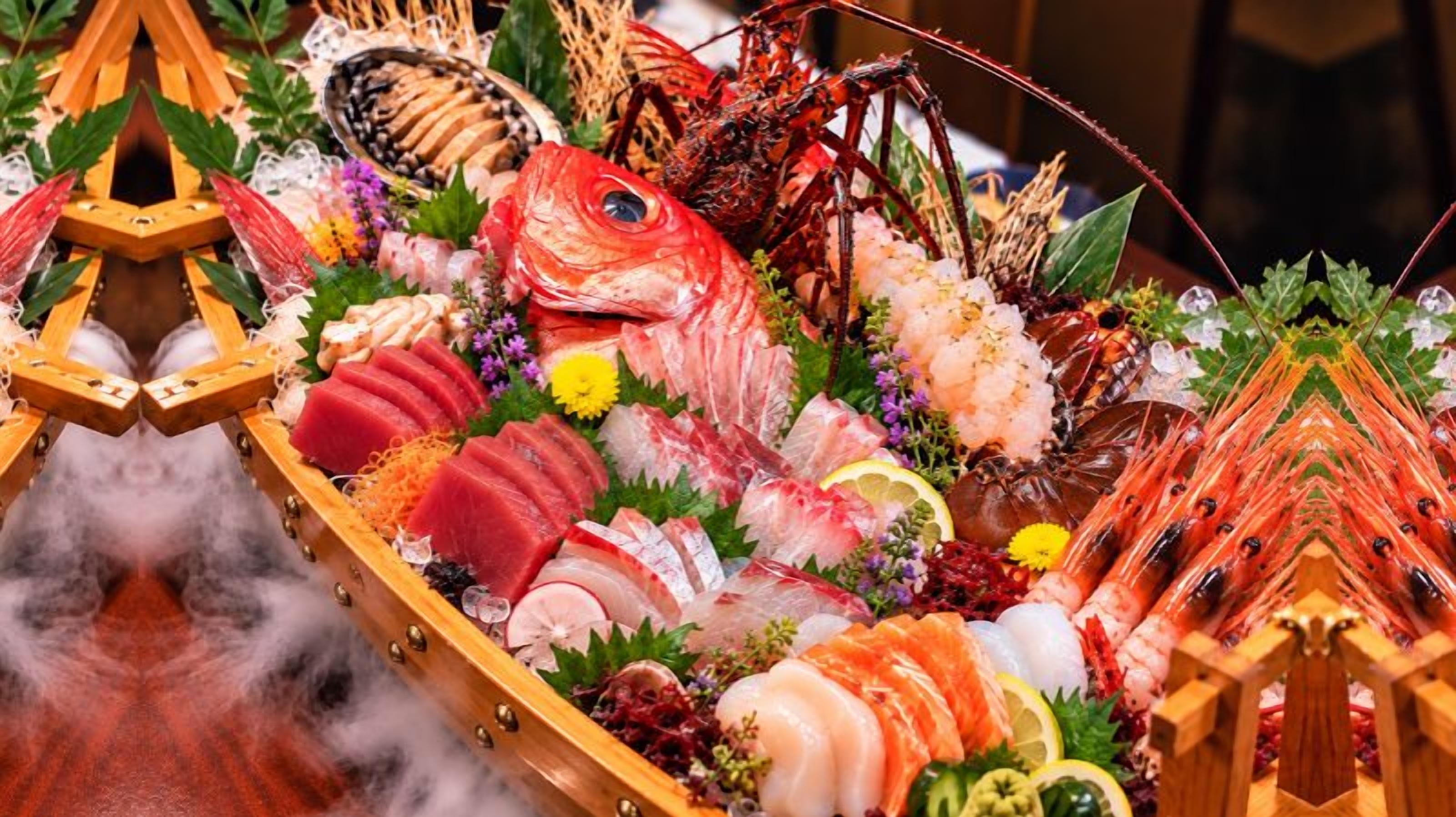 A seafood display with various types of fish and seafood.
