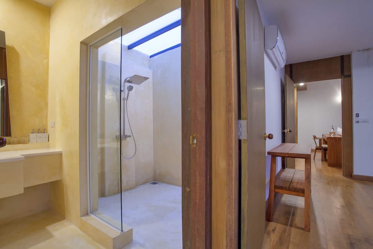 deluxe family villa | bathroom | shower, free toiletries, hair dryer, bathrobes