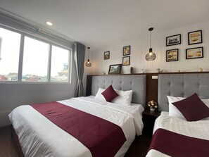 Family Room, City View | Minibar, in-room safe, desk, blackout curtains