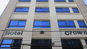 A multi-story hotel building with "Hotel" and "Crown" signage. - Hotel Crown (Tansen)