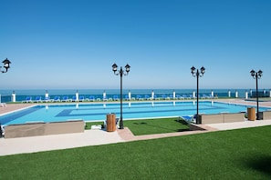 Indoor pool, outdoor pool, pool umbrellas, pool loungers
