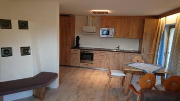 Exclusive Chalet, 2 Bedrooms, Kitchen (Schatzbergblick) | Private kitchen | Full-sized fridge, microwave, stovetop, dishwasher