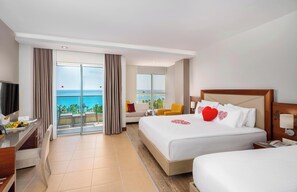 Suite junior, vista al mar | Ropa de cama de alta calidad y minibar 