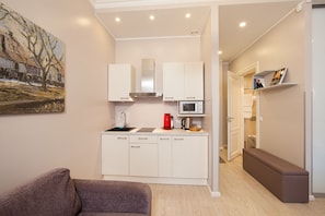 Deluxe Apartment, Balcony | Living area