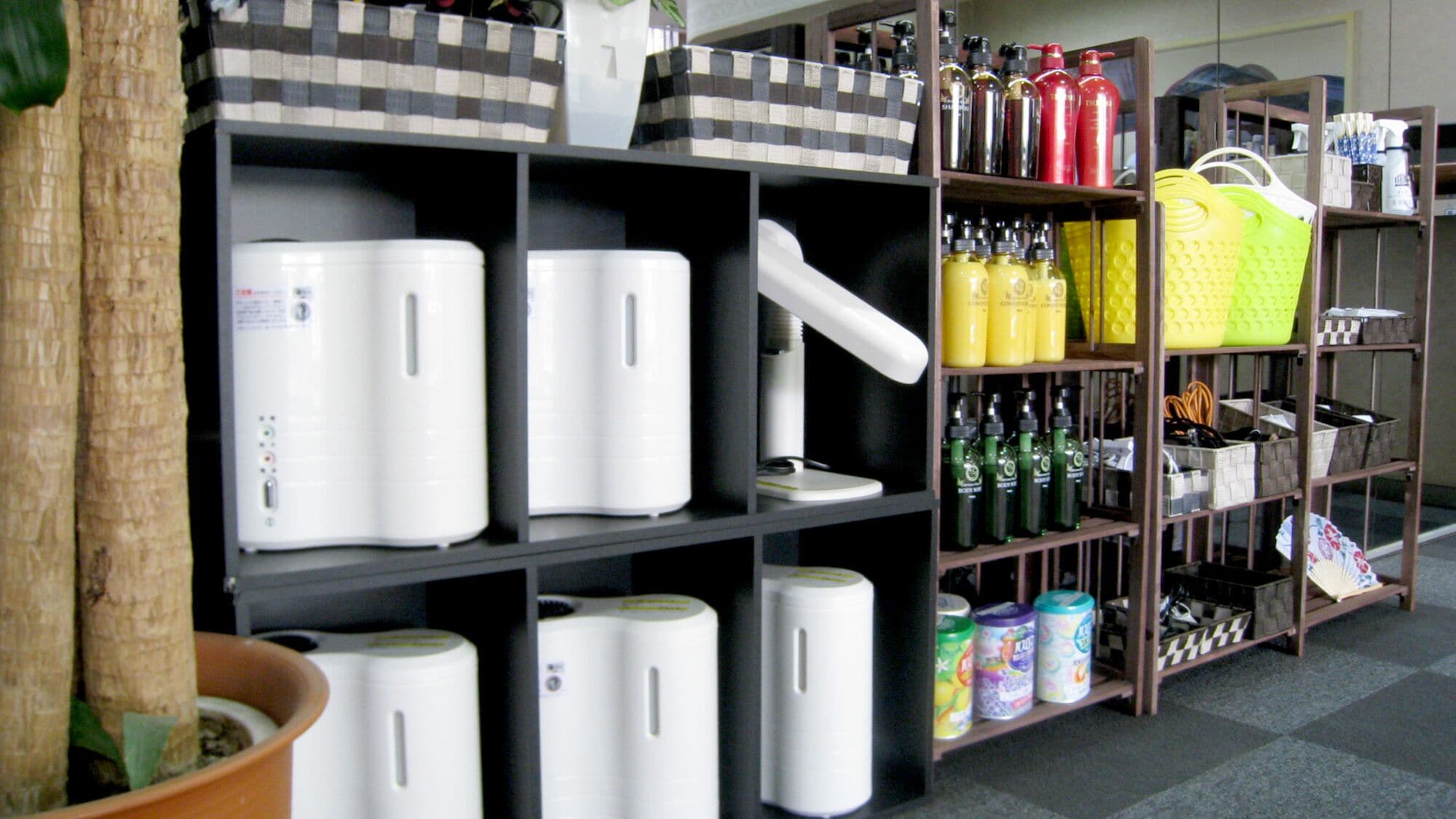 A storage area with shelves containing various items like bottles, containers, and baskets.