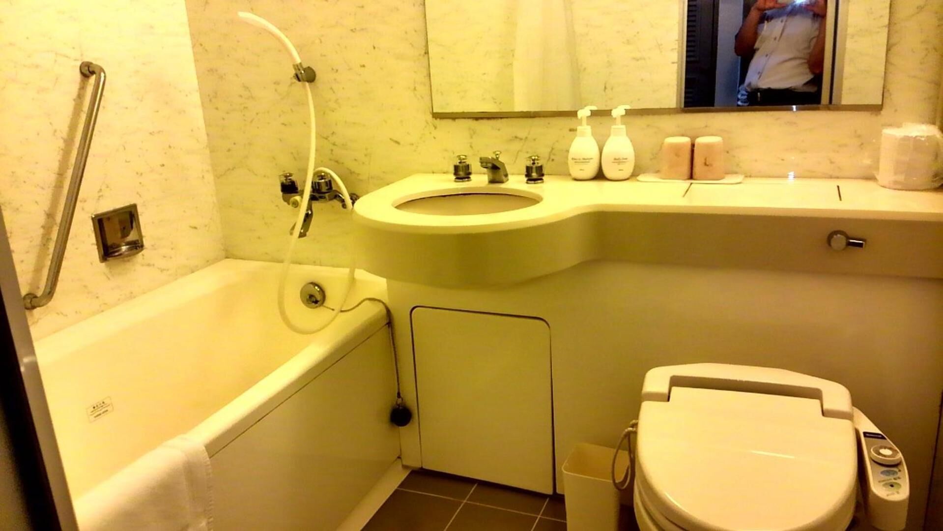 Combined shower/tub, hair dryer, slippers, electronic bidet