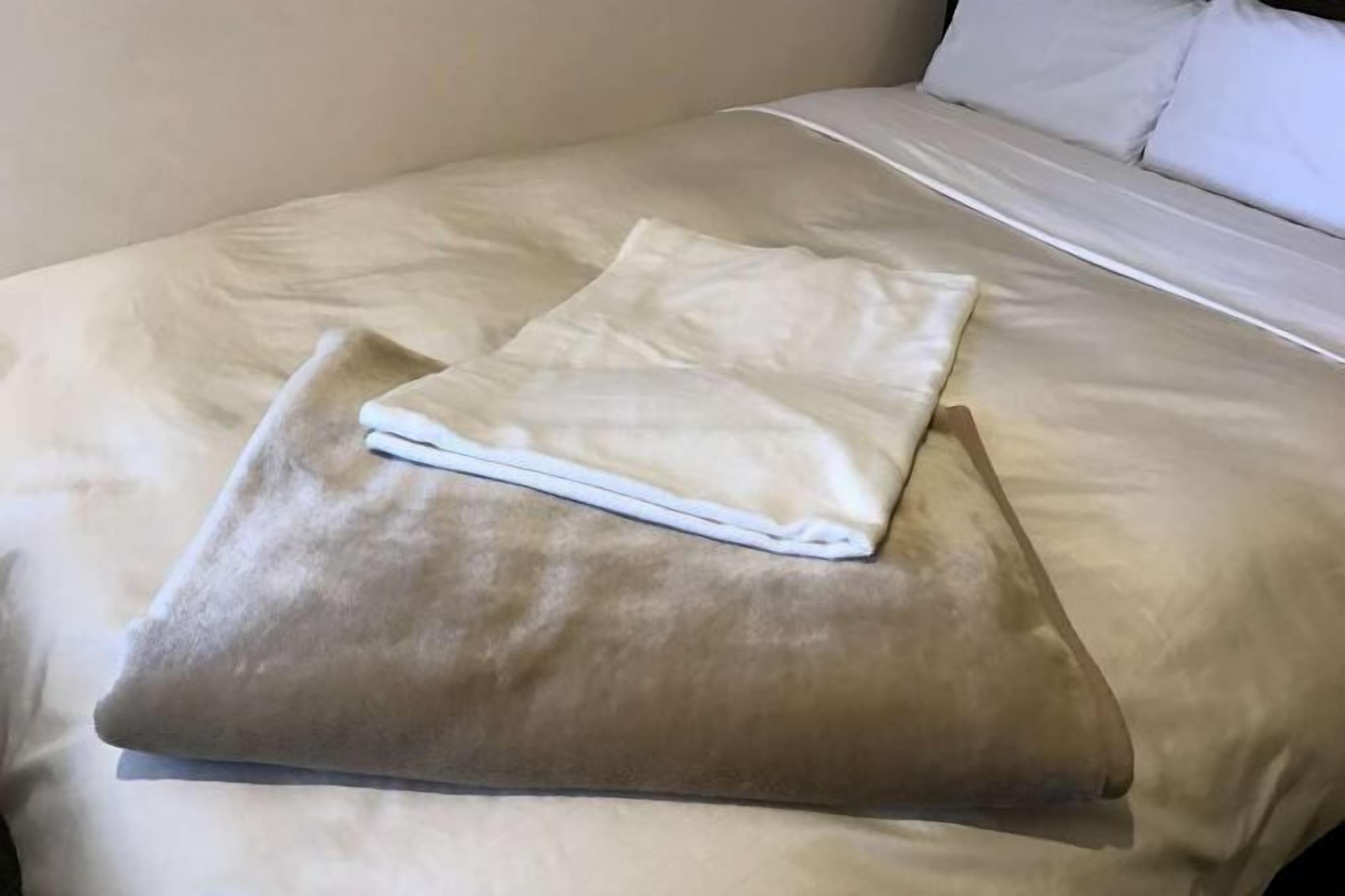 Premium bedding, down duvets, desk, laptop workspace