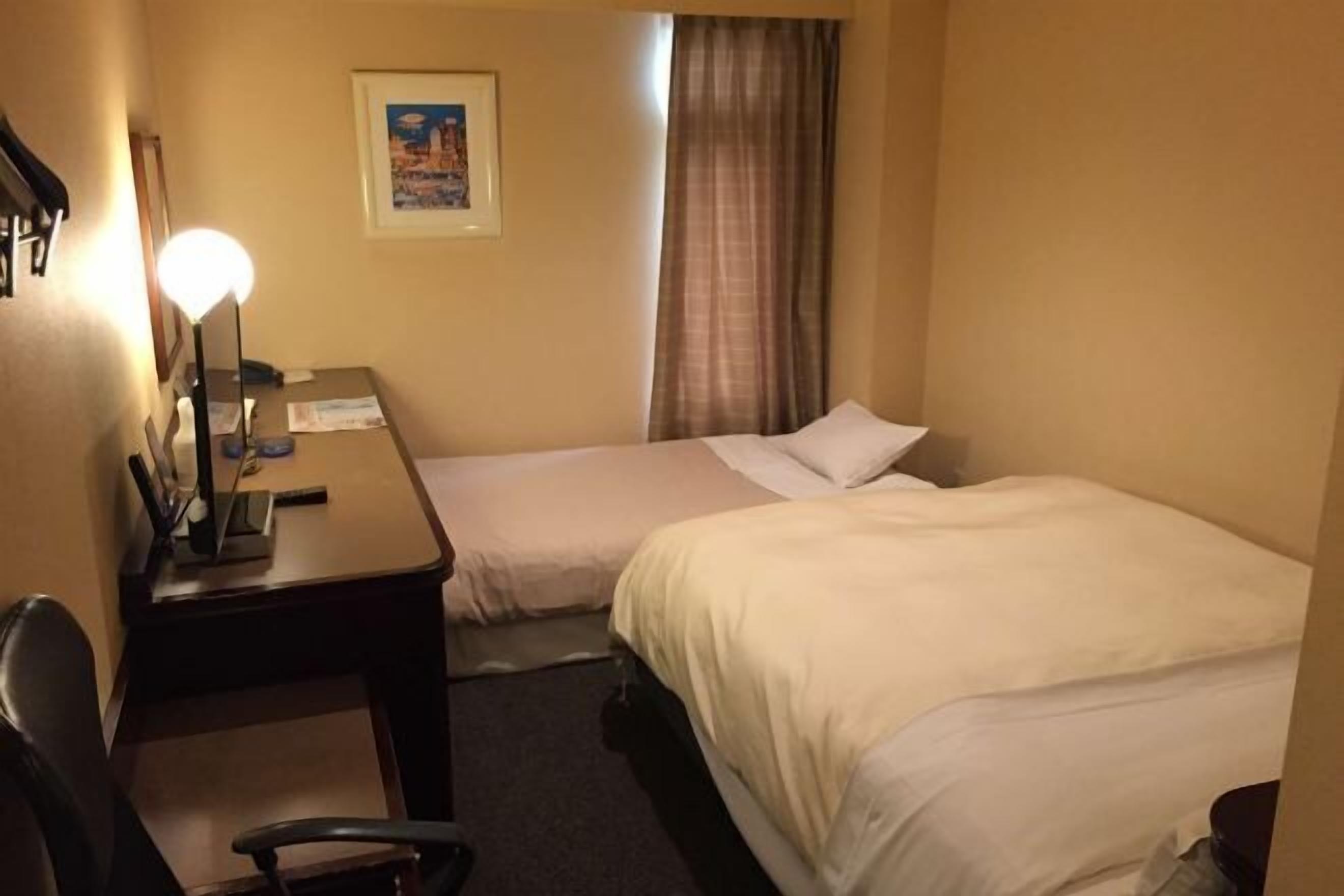 Premium bedding, down duvets, desk, laptop workspace