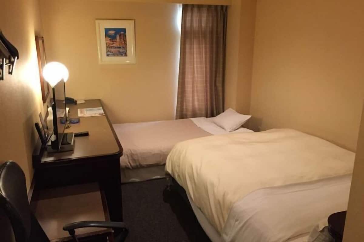 Premium bedding, down duvets, desk, laptop workspace